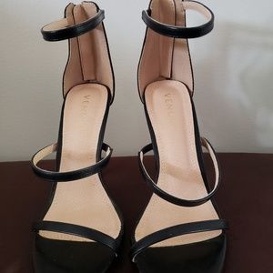 Strappy black heels.